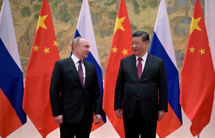 FILE PHOTO: Russian President Vladimir Putin attends a meeting with Chinese President Xi Jinping